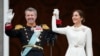 Denmark's King Frederik X and Denmark's Queen Mary wave from the balcony of Christiansborg Palace in Copenhagen, Jan. 14, 2024. 