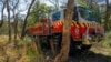 FILE — A New South Wales Rural Fire Service firetruck is seen at a hazard reduction burn site in Sydney, Australia, Sept. 10, 2023. Australia's southeast is going through a heat wave that has raised the risk of bushfires.