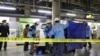 A person who is believed to have been stabbed on the Yamanote loop train line is transported by ambulance members at JR Akihabara Station in Tokyo, Japan, Jan. 3, 2024, in this photo released by Kyodo. 