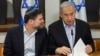 FILE - Israeli Prime Minister Benjamin Netanyahu, right, speaks with Minister of Finance Bezalel Smotrich during the weekly cabinet meeting at the Defense Ministry in Tel Aviv, Israel, Jan. 7, 2024.