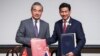 Chinese Foreign Minister Wang Yi, left, and Thai Foreign Minister Parnpree Bahiddha-Nukara shake hands during a signing ceremony of an agreement on mutual visa exemption, at the Ministry of Foreign Affairs in Bangkok, Thailand, Jan. 28, 2024.