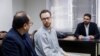Swedish EU employee Johan Floderus (C) attends a court session in Tehran on Dec. 10, 2023. The Swede who works for the EU diplomatic service, was arrested on Apr. 17, 2022, at Tehran airport as he was returning home from a trip with friends.