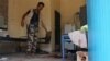 A Yemeni man inspects an elderly care home after it was attacked by gunmen in the port city of Aden, Yemen, March 4, 2016. Unidentified gunmen stormed a retirement home, killing more than a dozen people. 