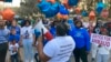 FILE - Thea Brooks, an aunt of Ahmaud Arbery, addresses supporters at the intersection where the Black man was fatally shot two years ago, in Brunswick, Ga., Feb. 23, 2022. Three white men who chased and killed Arbery have been convicted of murder and federal hate crimes.