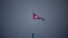 FILE - A North Korean flag flutters at the propaganda village of Gijungdong in North Korea, in this picture taken near the truce village of Panmunjom inside the demilitarized zone (DMZ) separating the two Koreas, South Korea, July 19, 2022. 