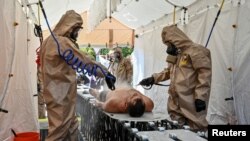 Архівне фото: представники Служби надзвичайних ситуацій України проходять навчання реагуванню на радіаційну небезпеку, Україна, серпень 2022 року