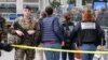 French police experts enter the cordoned off area after a knife attack at Gare de Lyon railway station, a major travel hub in Paris, on Feb. 3, 2024.