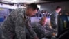 FILE A US Army captain explains predictions of space interference to a fellow Army officer March 10, 2015, in the Republic of Korea Air and Space Operation Center during exercise Key Resolve at Osan Air Base.