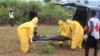 FILE - Health workers carry the body of an Ebola virus victim in the Waterloo district of Freetown, Sierra Leone. 