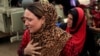 A newly internally displaced woman reacts upon her arrival at Al Khazar camp near Hassan Sham, east of Mosul, Iraq Oct. 28, 2016.