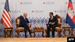 FILE - US President Joe Biden (L) meets Cambodia's Prime Minister Hun Sen on the sidelines of the Association of Southeast Asian Nations (ASEAN) Summit in Phnom Penh on November 12, 2022. (Photo by SAUL LOEB / AFP)