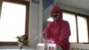 FILE - An employee of Pyongyang Dental Hygiene Products Factory disinfects the floor of a dinning room as the state increased measures to stop the spread of illness in Pyongyang, North Korea, May 16, 2022. 