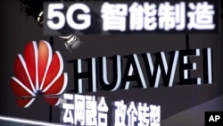 資料照片：華為公司在北京一次博覽會上的廣告。 2020年，美國司法部指控華為竊取六家美國公司的商業機密。