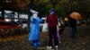 China Eases Some Quarantine for Travelers Even as Cases Rise 
