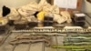This undated handout picture released by the Department of Agriculture and Water Resources on April 4, 2017 shows exotic snakes and spiders (in clear boxes) on display after they were found in shoe boxes in a Melbourne mail room.
