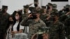 U.S. Marines salute during opening ceremonies of an annual joint military exercise called Kamandag the Tagalog acronym for "Cooperation of the Warriors of the Sea" at Fort Bonifacio, Taguig city, Philippines on Oct. 3, 2022. 