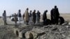 FILE - Pakistani officials investigate the site of bombing at Chaman, border post on the Pakistan Afghanistan border in Pakistan, Nov. 21, 2016.