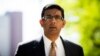Dinesh D'Souza exits the Manhattan Federal Courthouse after pleading guilty in New York, May 20, 2014. D'Souza pleaded guilty to one criminal count of making illegal contributions in the names of others.