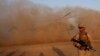 FILE - A U.S. Marine takes part during a training session for Afghan army commandos in Shorab military camp in Helmand province, Afghanistan, Aug. 27, 2017. 