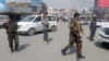 Afghan security forces keep watch near the site of a blast in Kabul, Afghanistan, March 9, 2018.