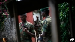 Wapiganaji wa kundi la waasi la M23 wakiwa katika mji wa Goma, mashariki mwa Jamhuri ya kidemokrasia ya Congo