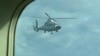 中菲再爆南中國海空中對峙 中國海軍直升機危險逼近菲律賓巡邏機三公尺之內