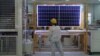 FILE - A worker conducts a quality check of a solar module at a factory in Xian, China, on Dec. 10, 2019. The European Union said on Jan. 24, 2024, that it wants to avoid over-reliance on China, which dominates in green technology production and other industries. 