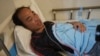 Survivor Zhu Pingfan from Hunan province, China, recuperates in a hospital bed, Sept. 24, 2022, Preah Sihanouk Province, Southwestern Cambodia after being rescued from a sinking boat days earlier. 