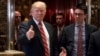President-elect Donald Trump gives a thumbs up to members of the media after meeting with Martin Luther King III, son of Martin Luther King Jr., at Trump Tower in New York, Jan. 16, 2017.