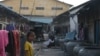 A girl stands in front of a rented house, frequented by garment workers, locate near Veng Sreng road on July 24, 2015. (Sou Pisen/VOA Khmer)