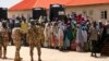 Security officers are called to control some of the internally displaced people at the Bakkasi camp. The people were upset at camp authorities for what they say is poor distribution of food rations, in Borno, Nigeria, on August 29, 2016.