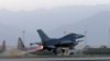 FILE - A U.S. Air Force F-16 Fighting Falcon aircraft takes off for a nighttime mission at Bagram Airfield, Afghanistan, Aug. 22, 2017. 