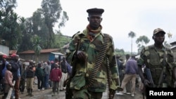 Waasi wa M23 wakiwa katika mji wa Karuba, kilomita 62, magharibi mwa mji wa Goma, Kivu kaskazini, Mashariki mwa DRC