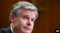 FILE - Director of the Federal Bureau of Investigation Christopher Wray testifies during a Senate Appropriations Subcommittee hearing in Washington, May 25, 2022. He and the leader of Britain's domestic intelligence agency raised alarms about the Chinese government on Wednesday.