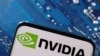 FILE - A smartphone with a displayed NVIDIA logo is placed on a computer motherboard in this illustration taken March 6, 2023. 