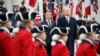 President Donald Trump and French President Emmanuel Macron stand during a State Arrival Ceremony on the South Lawn of the White House in Washington, April 24, 2018.