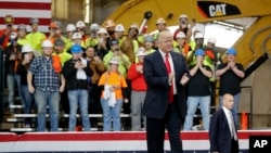 President Donald Trump prepares to speak at Local 18 Richfield Training Facility, March 29, 2018, in Richfield, Ohio.