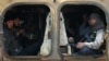 Rebel fighters ride a military vehicle with their weapons in Dahiyet al-Assad, west Aleppo city, Syria, Oct. 30, 2016. 