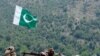 A Pakistani soldier takes position in Manatu mountain at the central part of Kurram Agency, Pakistan's tribal belt bordering Afghanistan, during an operation against militants, July 10, 2011. 