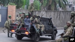Waasi wa M23 wakifanya doria katika mitaa ya mji wa Goma, Januari 29.