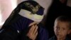 FILE - a woman cries after talking about her nephew, 10-year-old Youssef al-Salmi, who was killed when a bomb exploded while he was playing with it near his family's house, in Hasn Faj Attan village, on the mountainous outskirts of Sanaa, Yemen. 