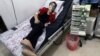 A civilian breathes through an oxygen mask at al-Quds hospital after an alleged chlorine gas attack alongside barrel bombs on a neighborhood of Aleppo, Syria, Aug. 11, 2016.