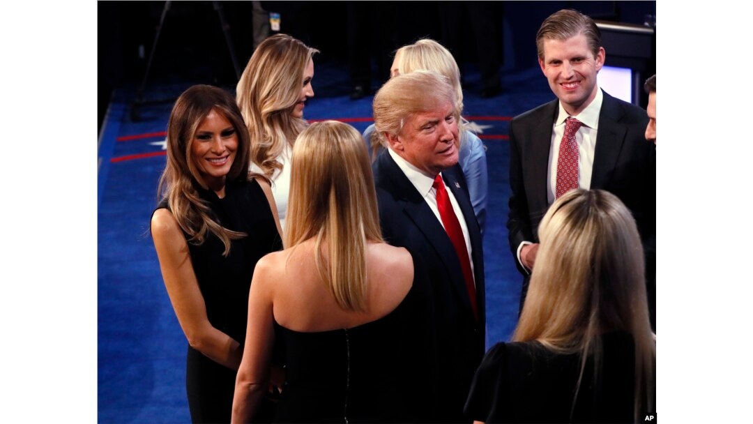 Donald Trump talks to his family after debate.