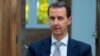 A handout picture released by the Syrian presidency's press office shows Syrian President Bashar al-Assad during an interview with AFP in the capital Damascus, on April 12, 2017. 