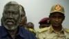 Le général Mohamed Hamdan Daglo (d) écoute Malik Agar (g) le chef du Mouvement populaire de libération du Soudan-Nord, alors chef adjoint soudanais du Conseil militaire de transition, à Juba, au Soudan du Sud, le 27 juillet 2019. 