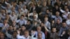 FILE - Iranian worshippers chant slogans against Bahraini regime and Saudi Arabia during Friday prayers in Tehran, Iran, May 26, 2017.