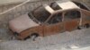 FILE - A vehicle allegedly used by IS militants in a suicide attack is seen in Sinjar, Iraq, Nov. 14, 2016. (H. Murdock/VOA)