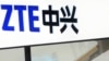 FILE- A sign for the ZTE booth is seen at the Mobile World Congress, the world's largest mobile phone trade show in Barcelona, Spain, Feb. 26, 2014.