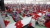 Hit by Pandemic, A Handful of Garment Factories Switch to Mask Production 