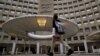 A pedestrian passes the Department of Housing and Urban Developement at the start of the third day of a shut down of the federal government in Washington, Jan. 22, 2018. 